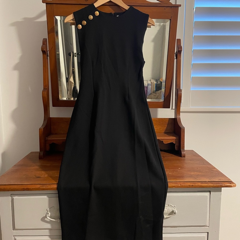 Elegant Black Sleeveless Dress with Gold Button Accents